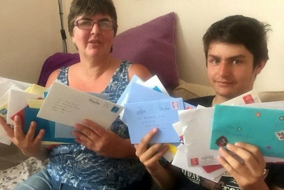 autistic boy and mum with cards