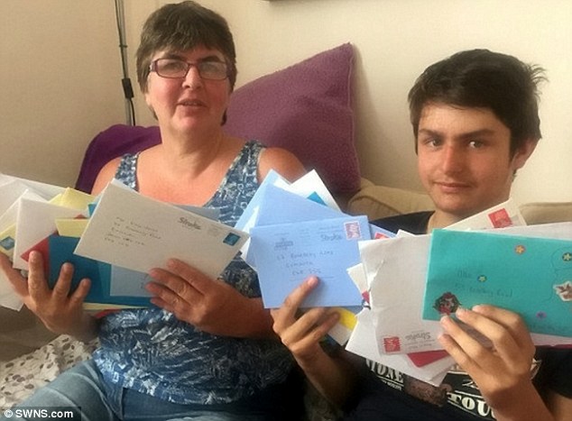 autistic boy and mum with cards