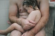 dad holding son in the shower3