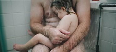 dad holding son in the shower3