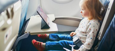 woman wanted me to take my iPad off my daughter on the plane